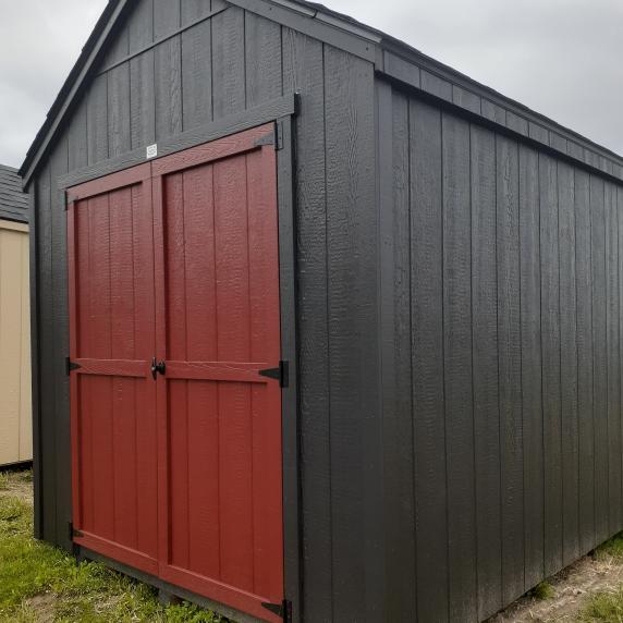 Garden storage shed black walls red doors